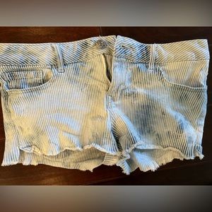 express jean shorts. it has a design with stripes. it is a size 4!